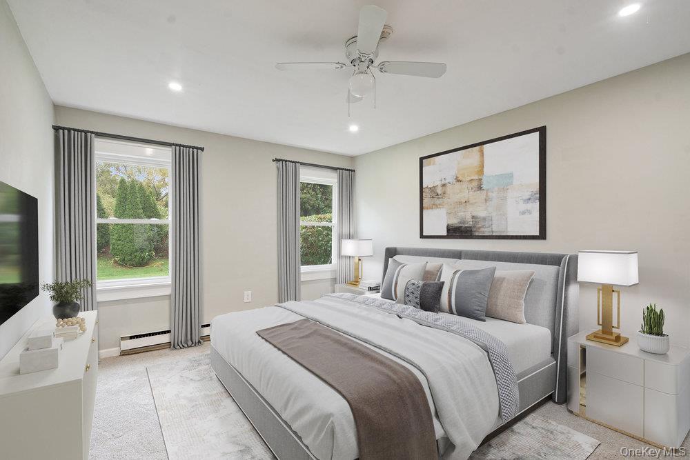 53 Freedom Lane Coram, NY 11784 - Photo 11 of 29 a bedroom with a large bed and a window