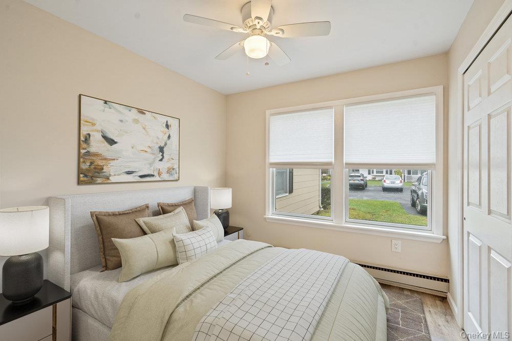 53 Freedom Lane Coram, NY 11784 - Photo 13 of 29 a bedroom with a large bed and a window