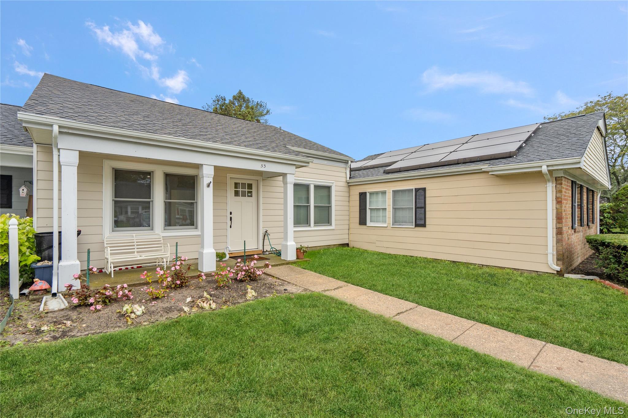 53 Freedom Lane Coram, NY 11784 - Photo 2 of 29 a front view of a house with a garden