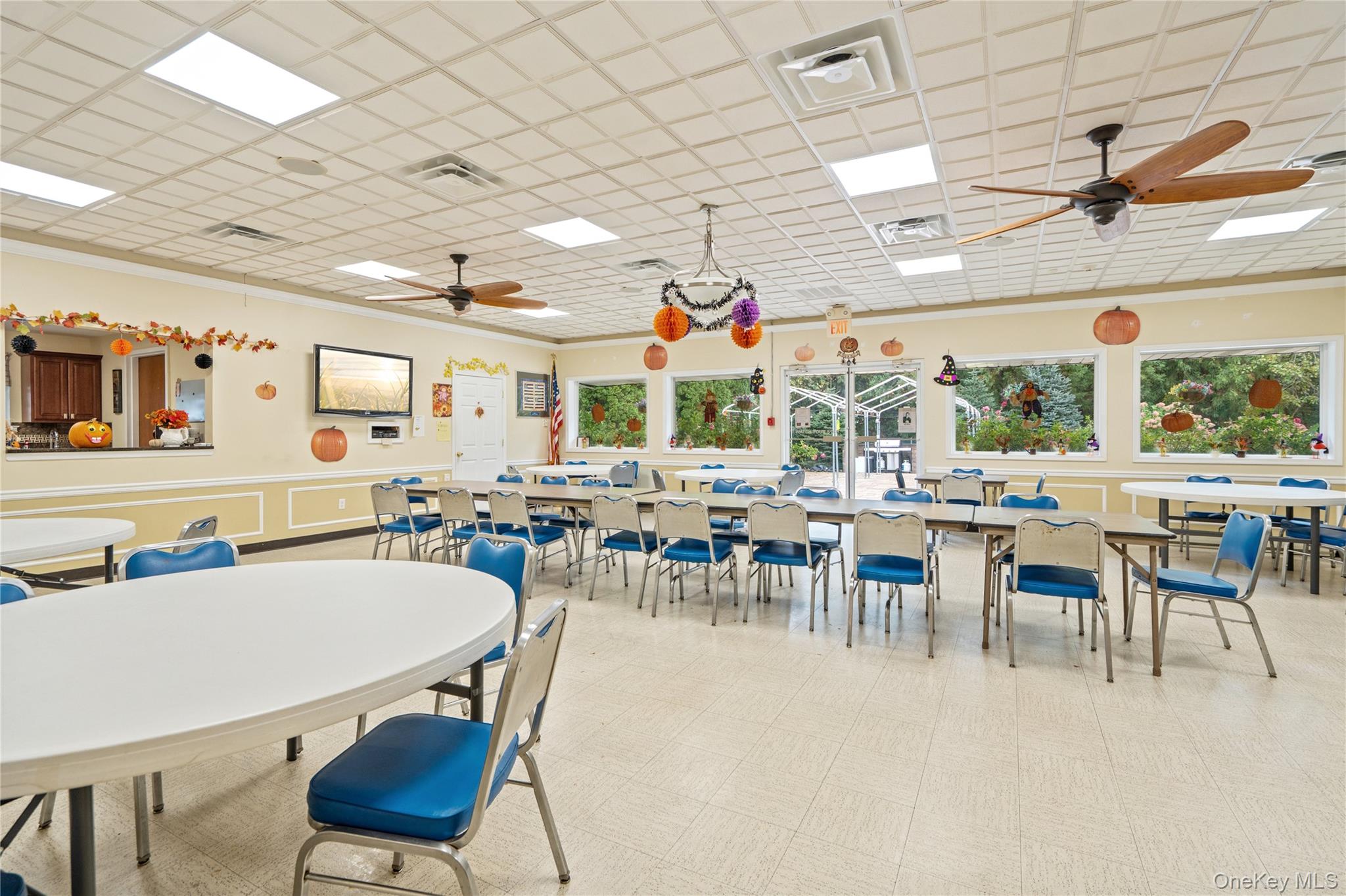 53 Freedom Lane Coram, NY 11784 - Photo 22 of 29 a group of people sitting in a living room