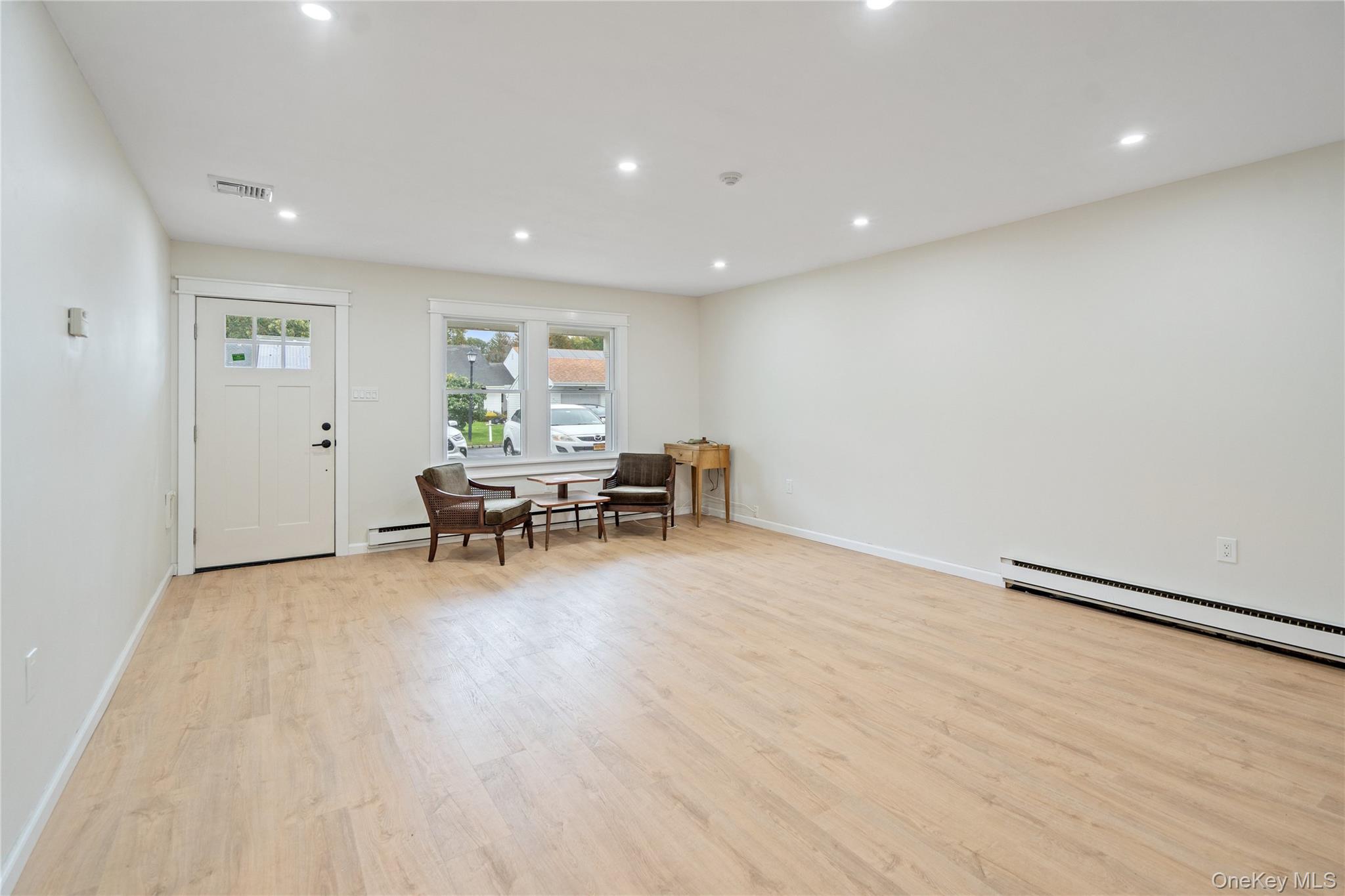 53 Freedom Lane Coram, NY 11784 - Photo 4 of 29 a view of work space with wooden floor and furniture