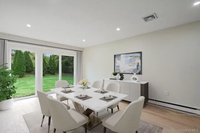 a view of a dining room with furniture window and outside view