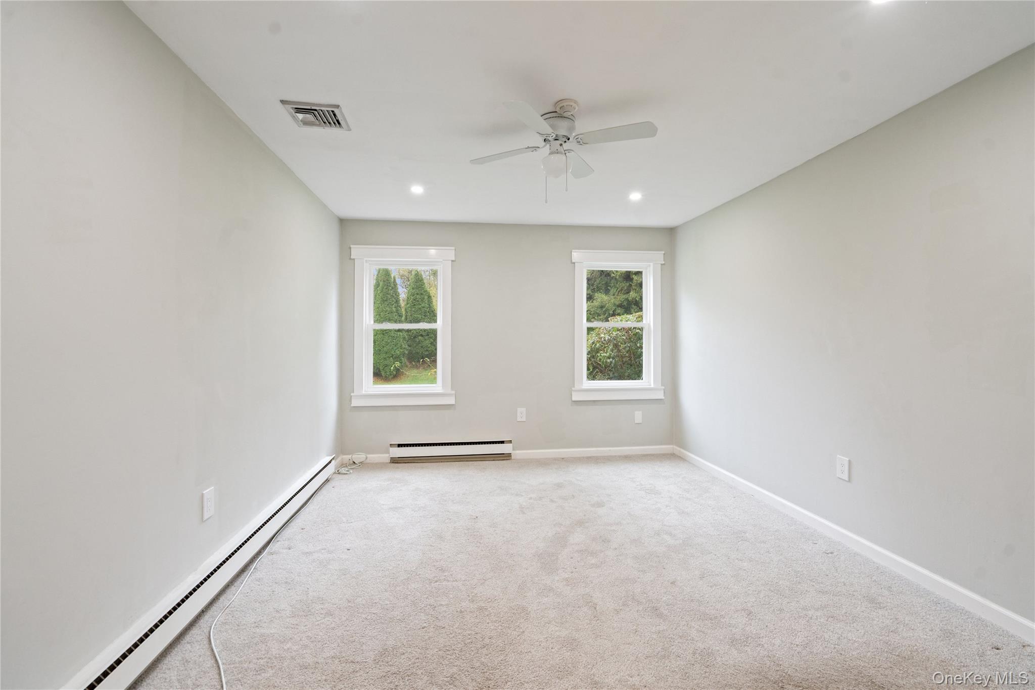 53 Freedom Lane Coram, NY 11784 - Photo 10 of 29 an empty room with windows