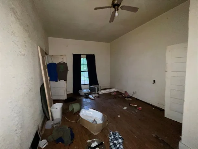 a living room with furniture and a mirror