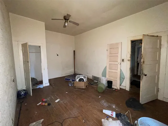 a room with gym equipment and a walk in closet