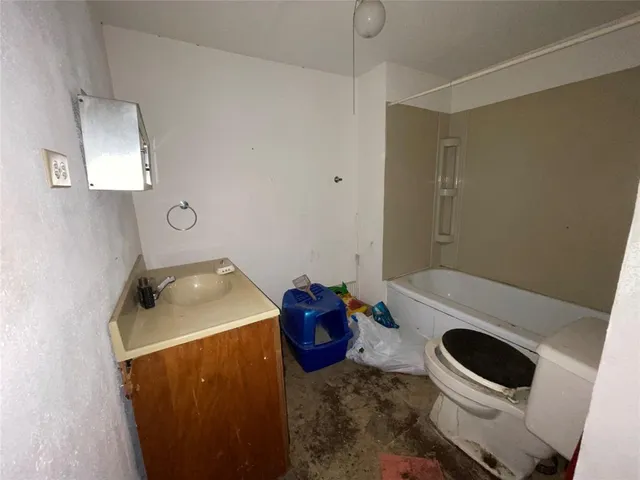 a bathroom with a toilet and a sink