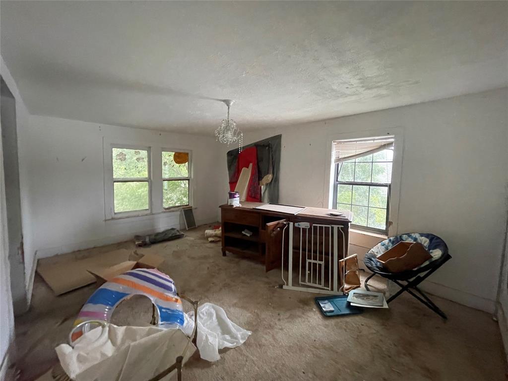408 North Wichita Street Electra, TX 76360 - Photo 20 of 23 a bedroom with furniture and a window