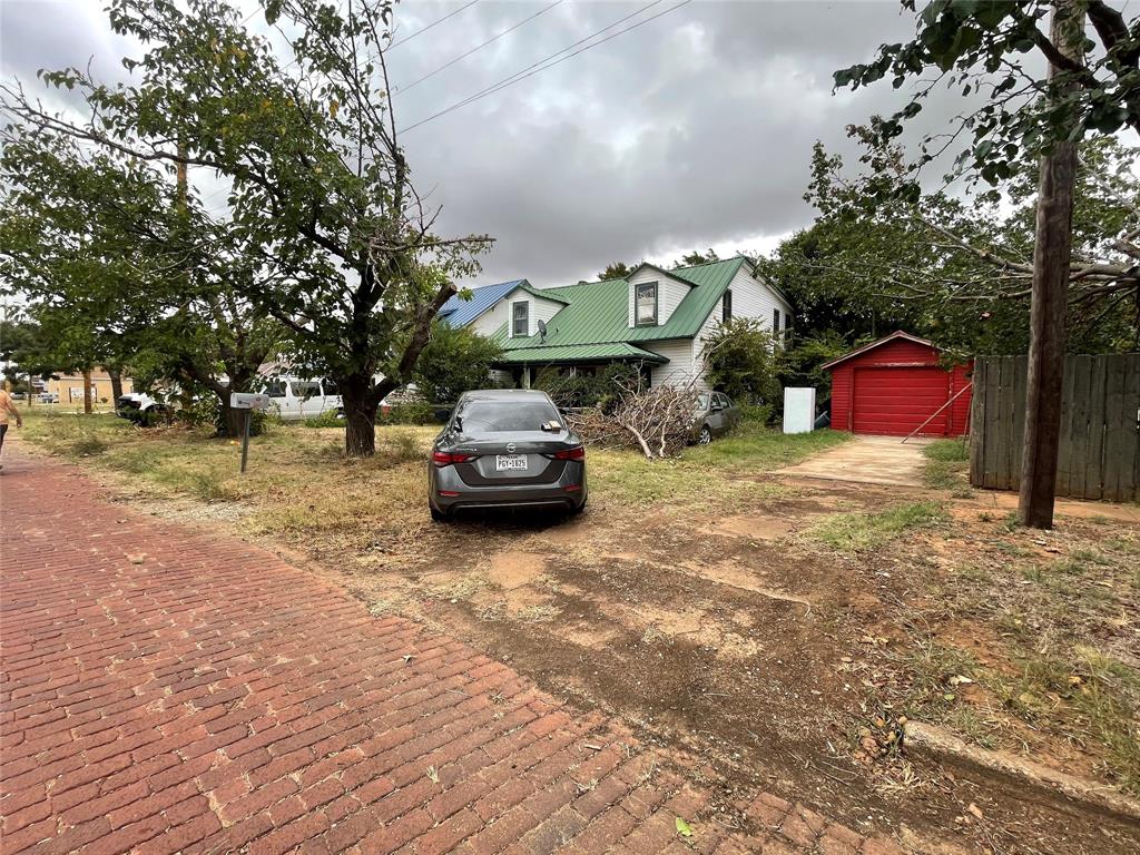 408 North Wichita Street Electra, TX 76360 - Photo 3 of 23 a car parked in front of a house