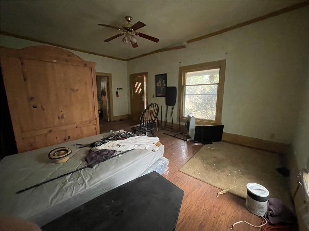 408 North Wichita Street Electra, TX 76360 - Photo 6 of 23 a bedroom with a bed dresser and a window