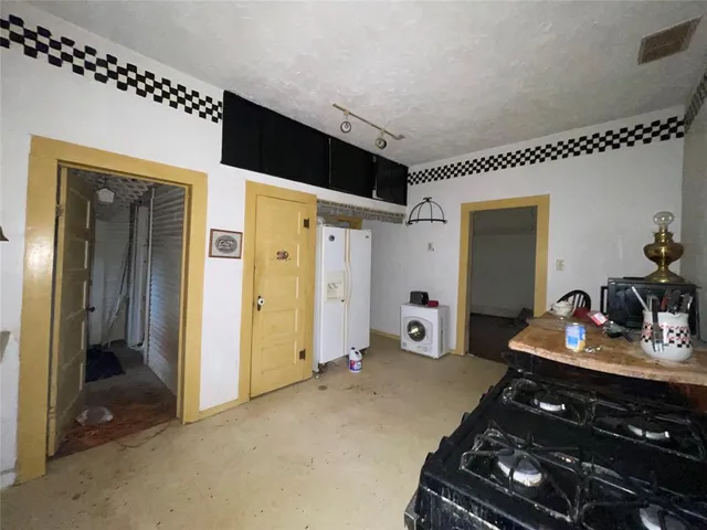 a bed room with a bed and a mirror