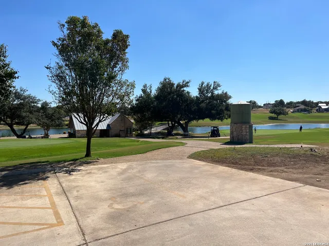 a view of a lake with a house in the background