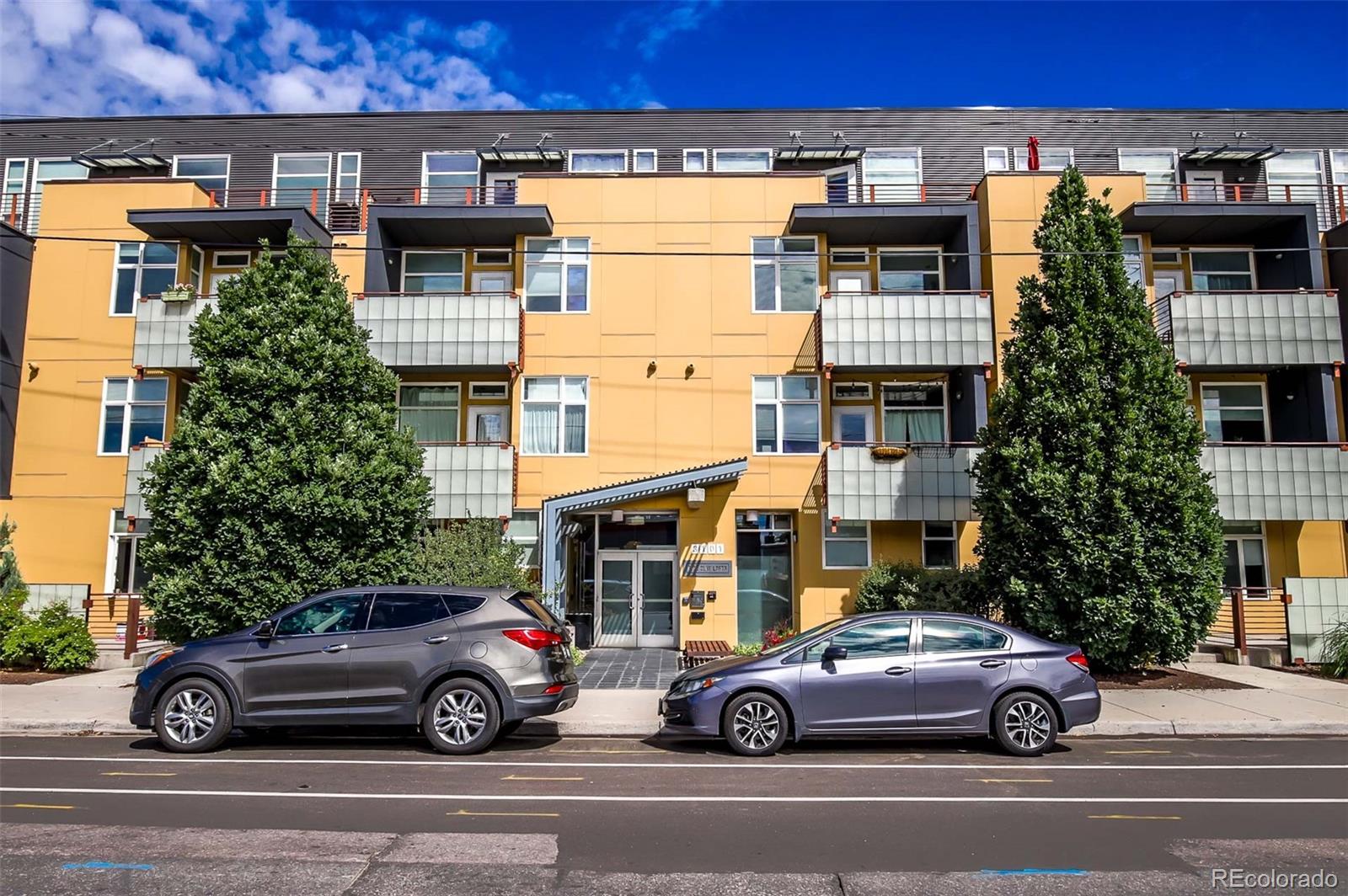 3101 Blake Street, Unit 305 Denver, CO 80205 - Photo 24 of 28 a car parked in front of a building