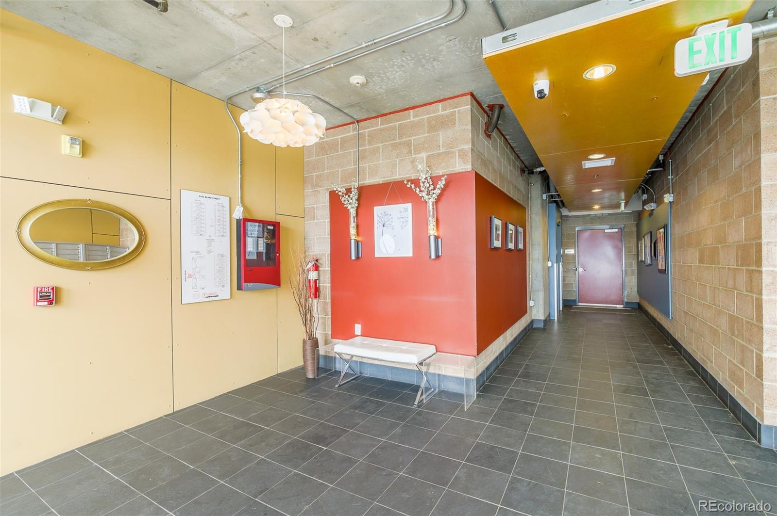 3101 Blake Street, Unit 305 Denver, CO 80205 - Photo 27 of 28 a bathroom with a sink a mirror and a shower