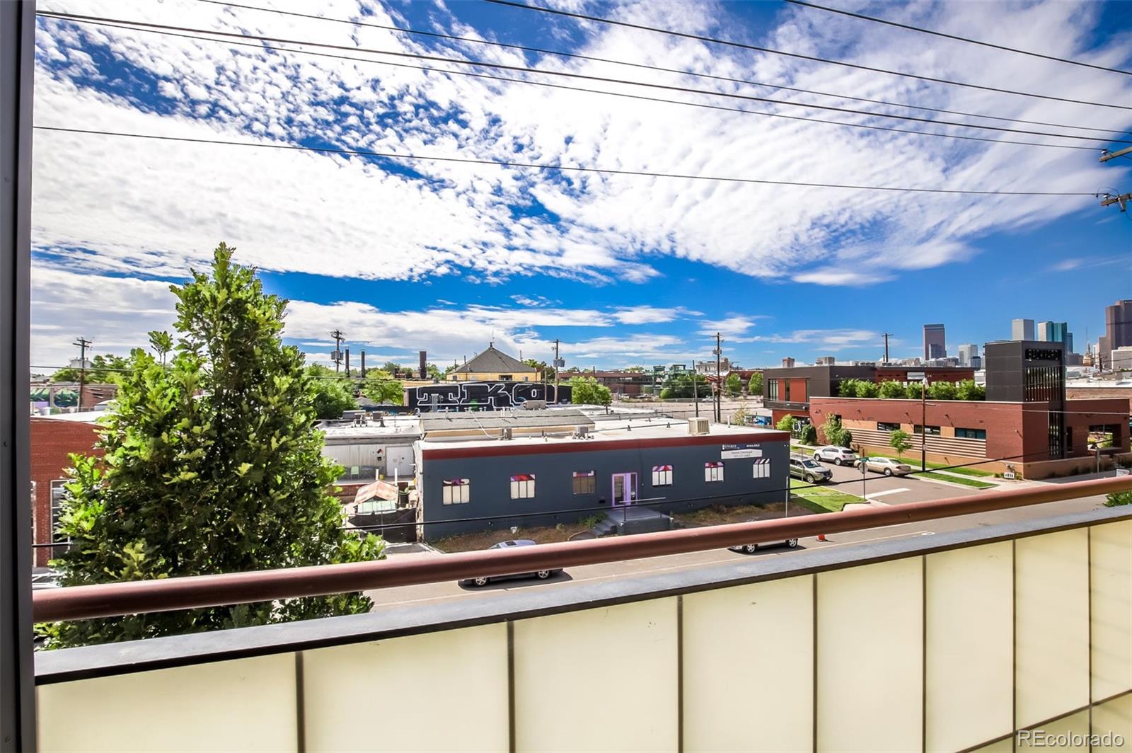 3101 Blake Street, Unit 305 Denver, CO 80205 - Photo 3 of 28 a view of city from a balcony