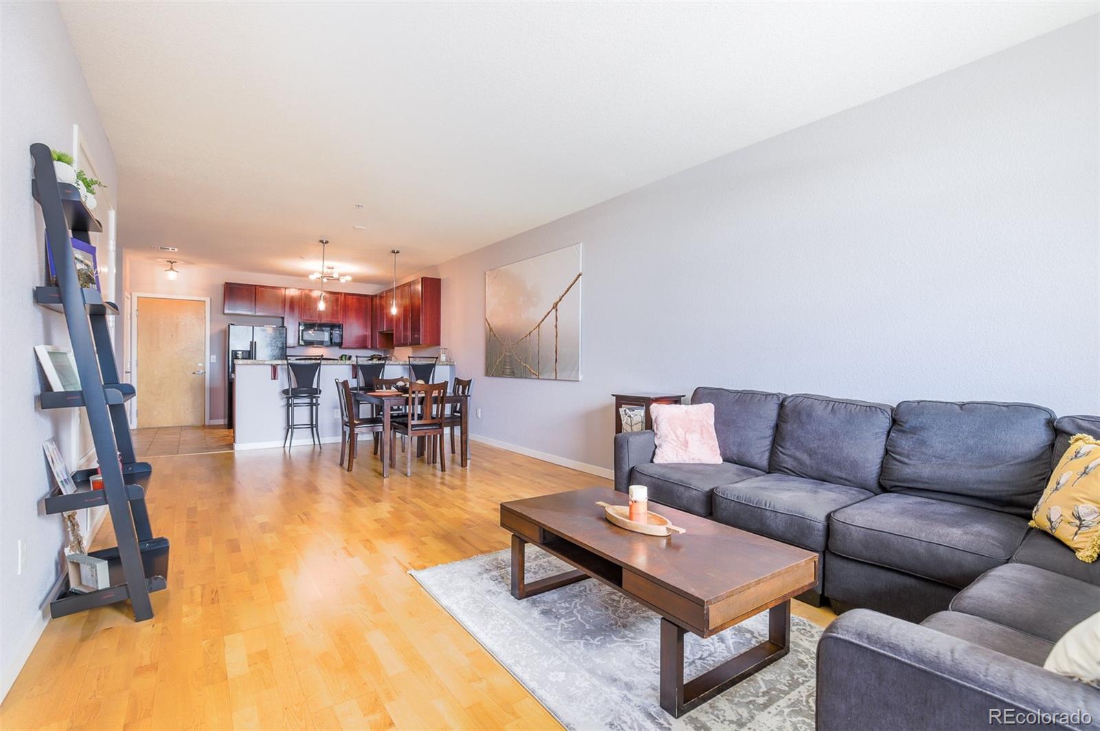 3101 Blake Street, Unit 305 Denver, CO 80205 - Photo 7 of 28 a living room with furniture and a table