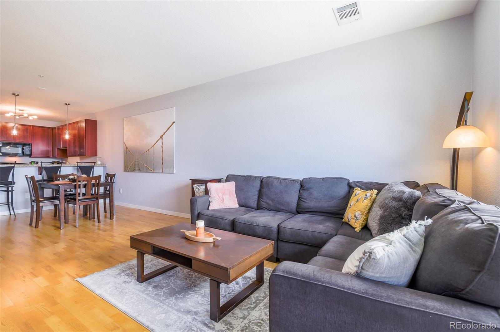 3101 Blake Street, Unit 305 Denver, CO 80205 - Photo 8 of 28 a living room with furniture and a table