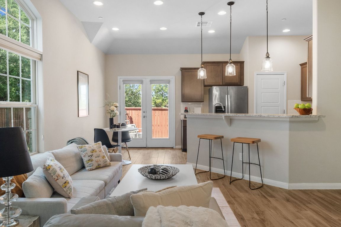 Welcome to 1404 Catalan, that features an open-concept design with kitchen and living connection.