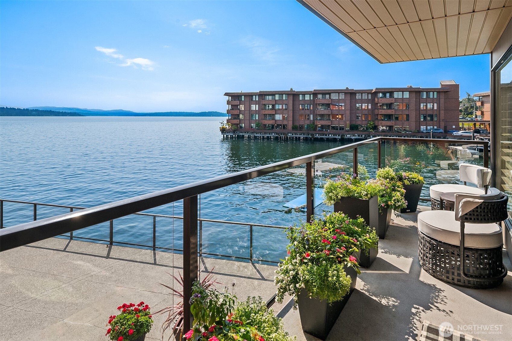 2360 43rd Avenue East, Unit 211 Seattle, WA 98112 - Photo 12 of 26 a view of a balcony with chairs