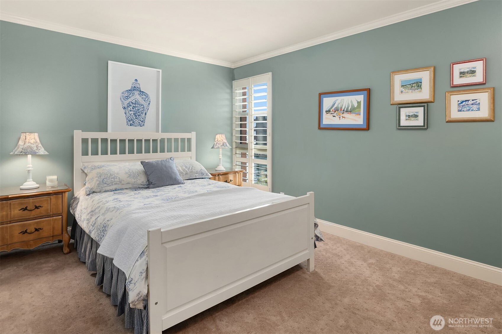 2360 43rd Avenue East, Unit 211 Seattle, WA 98112 - Photo 16 of 26 a bed sitting in a bedroom next to a window