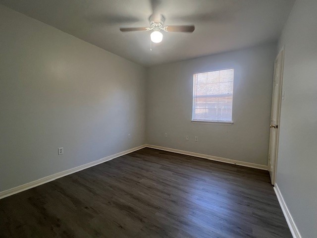 4721 9th Street, Unit A Bacliff, TX 77518 - Photo 11 of 27 a view of an empty room with wooden floor and a window
