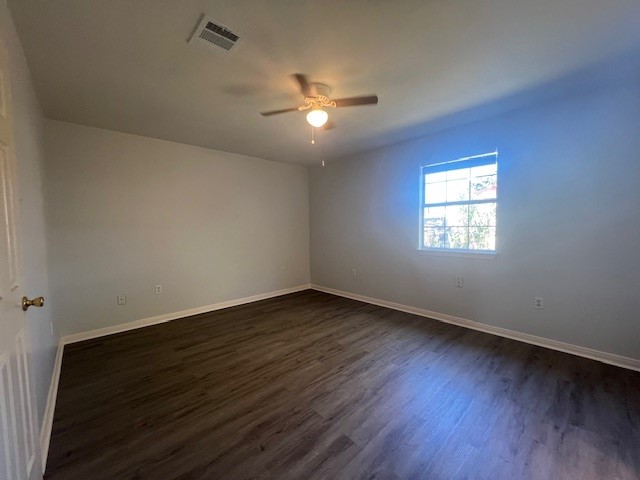 4721 9th Street, Unit A Bacliff, TX 77518 - Photo 19 of 27 a view of an empty room with wooden floor and a window