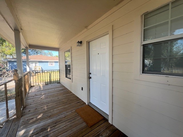 4721 9th Street, Unit A Bacliff, TX 77518 - Photo 3 of 27 a view of a balcony with wooden floor