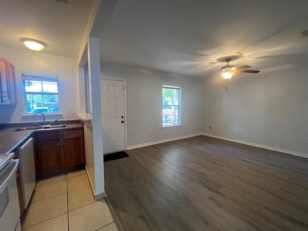 a view of a kitchen with dishwasher and a stove