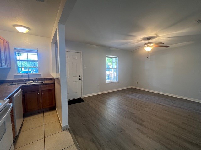4721 9th Street, Unit A Bacliff, TX 77518 - Photo 6 of 27 a view of a kitchen with dishwasher and a stove