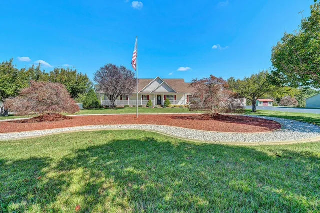 a view of outdoor space with garden and trees