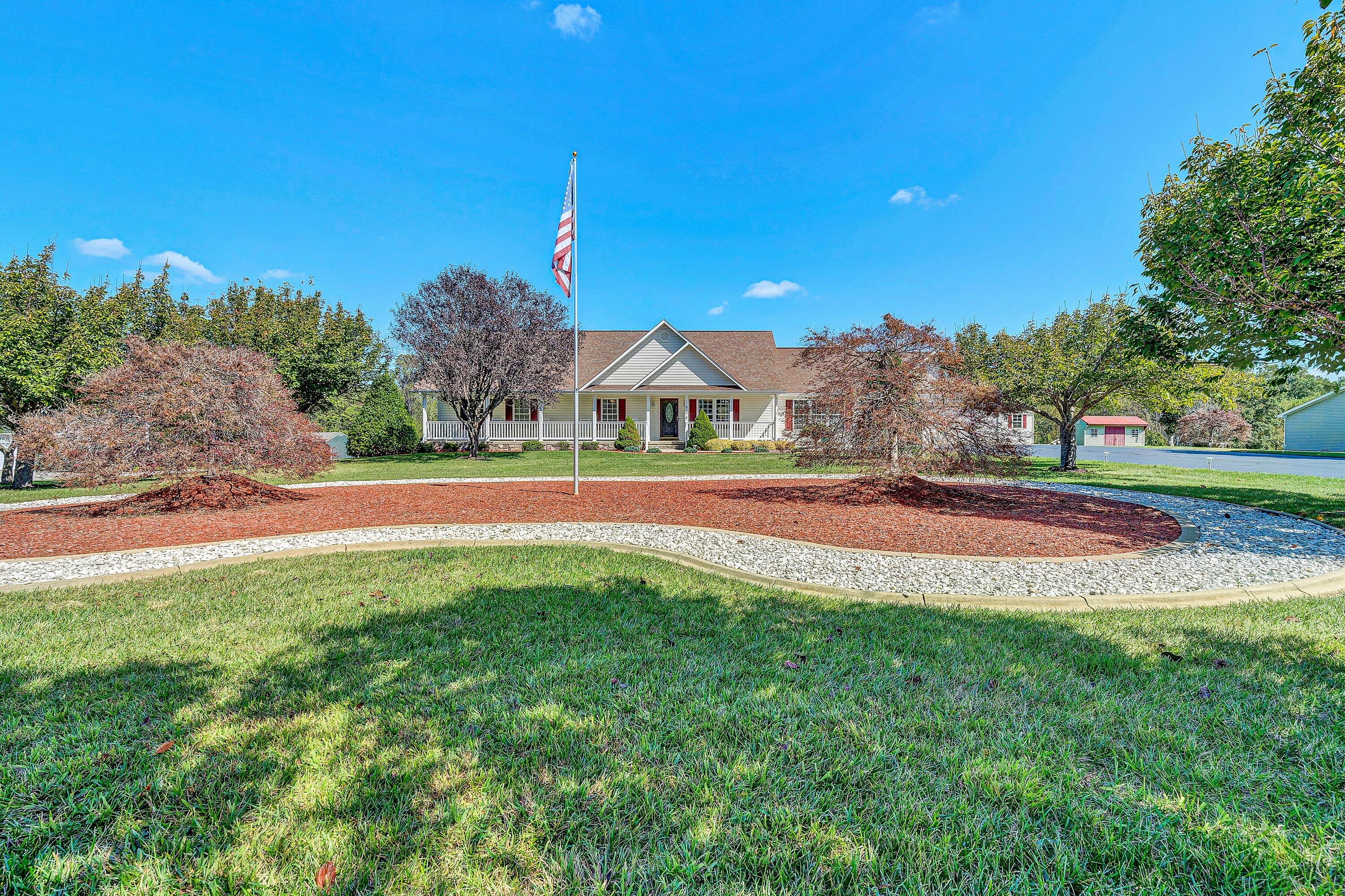 a view of outdoor space with garden and trees