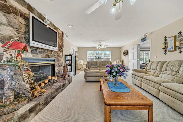 a view of a livingroom with a dishwasher and cabinets