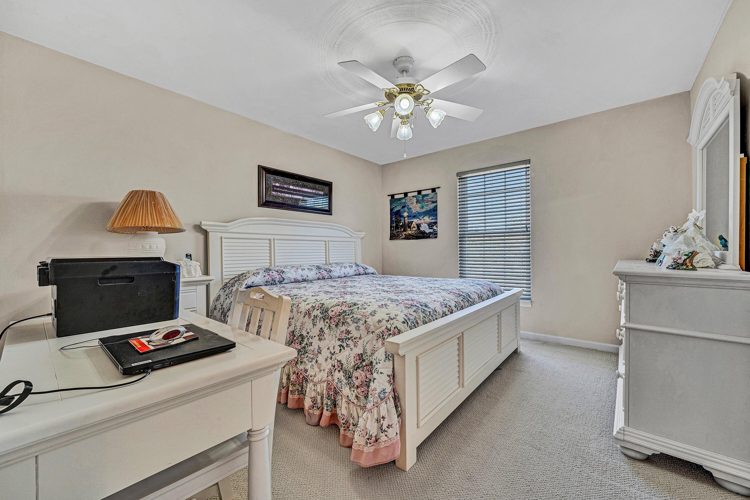 1850 Emmaus Church Road Moneta, VA 24121 - Photo 25 of 63 a bedroom with a bed and a chandelier