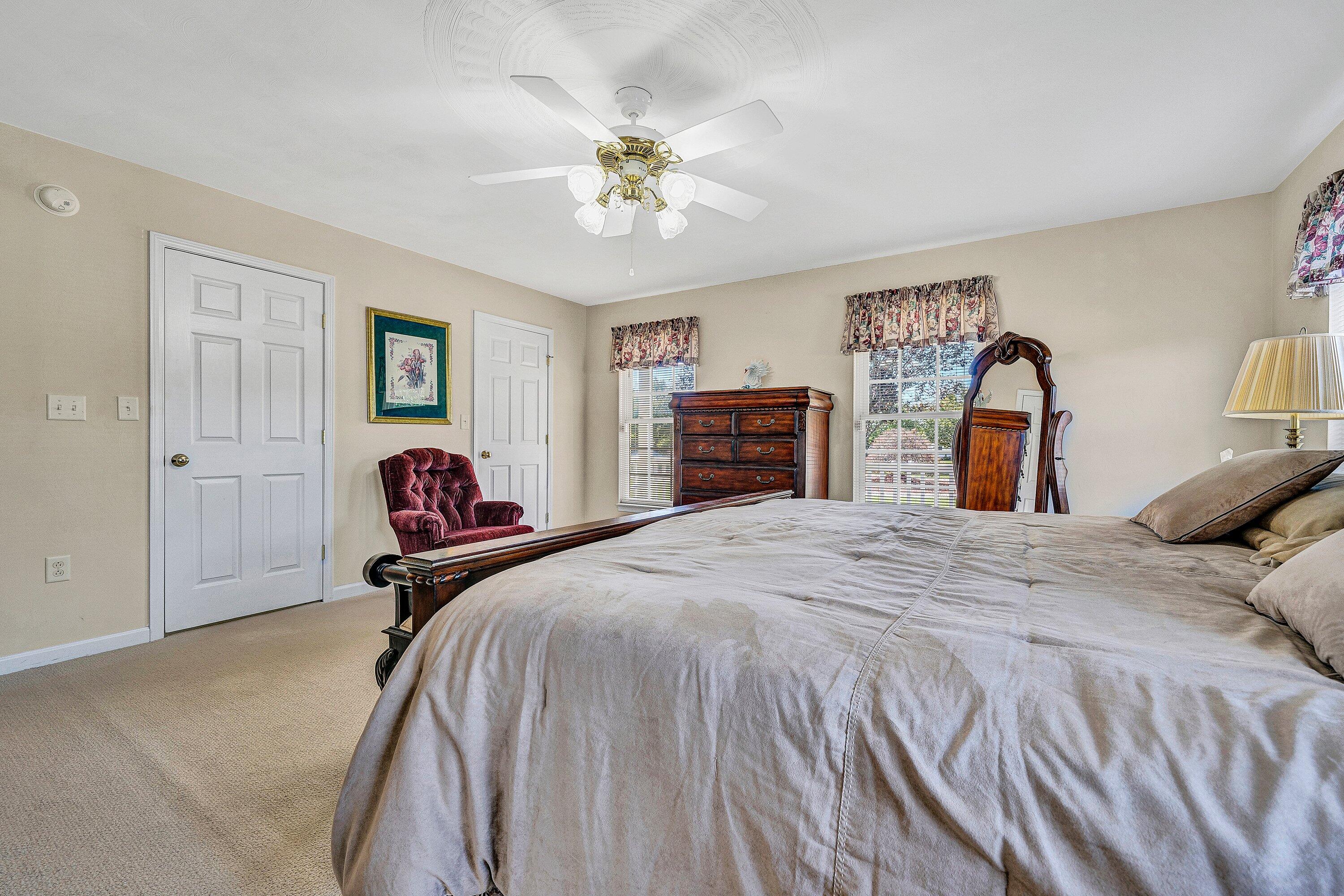 1850 Emmaus Church Road Moneta, VA 24121 - Photo 27 of 63 a bedroom with a bed and a chandelier