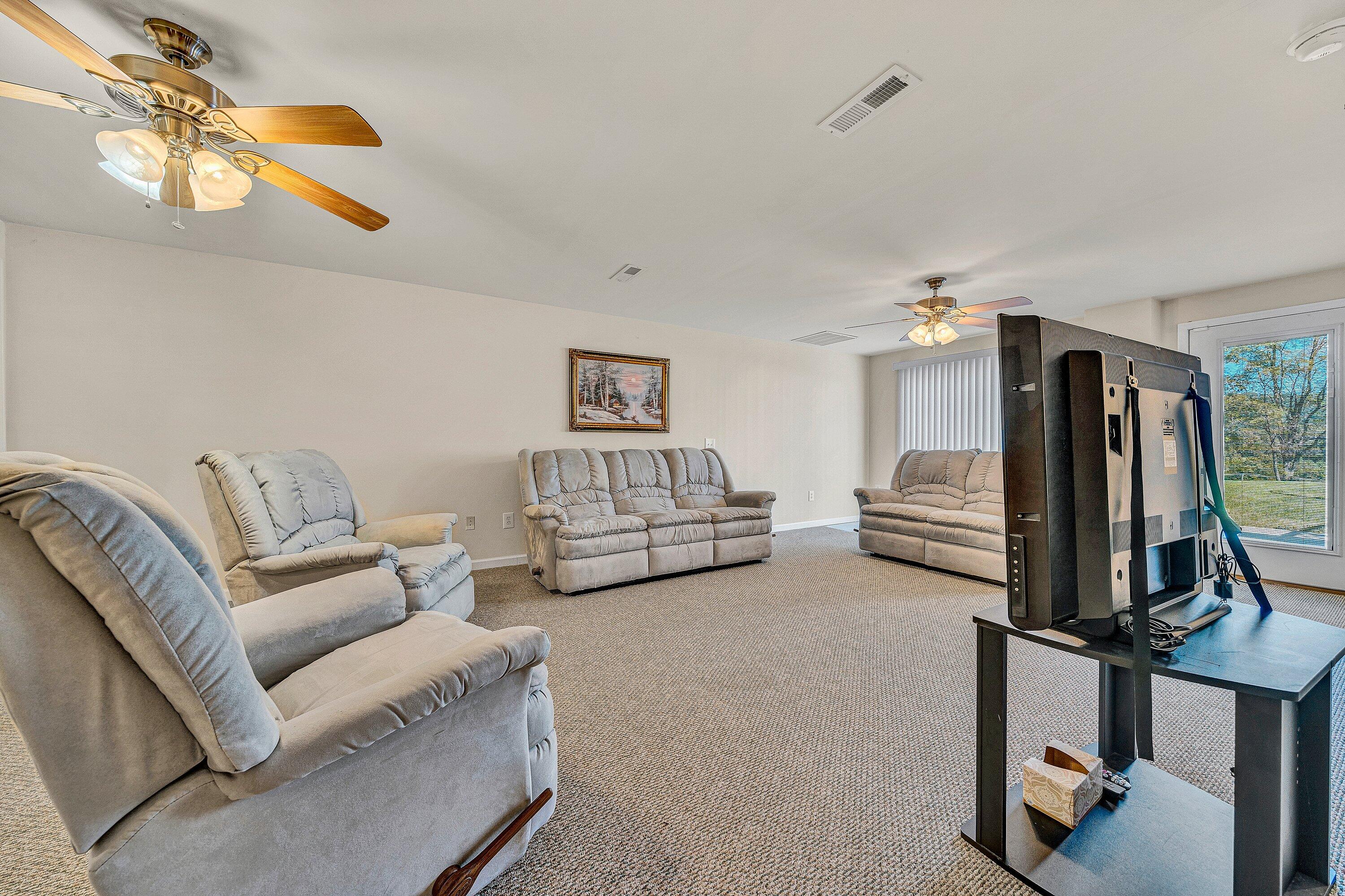 1850 Emmaus Church Road Moneta, VA 24121 - Photo 36 of 63 a living room with furniture and a flat screen tv