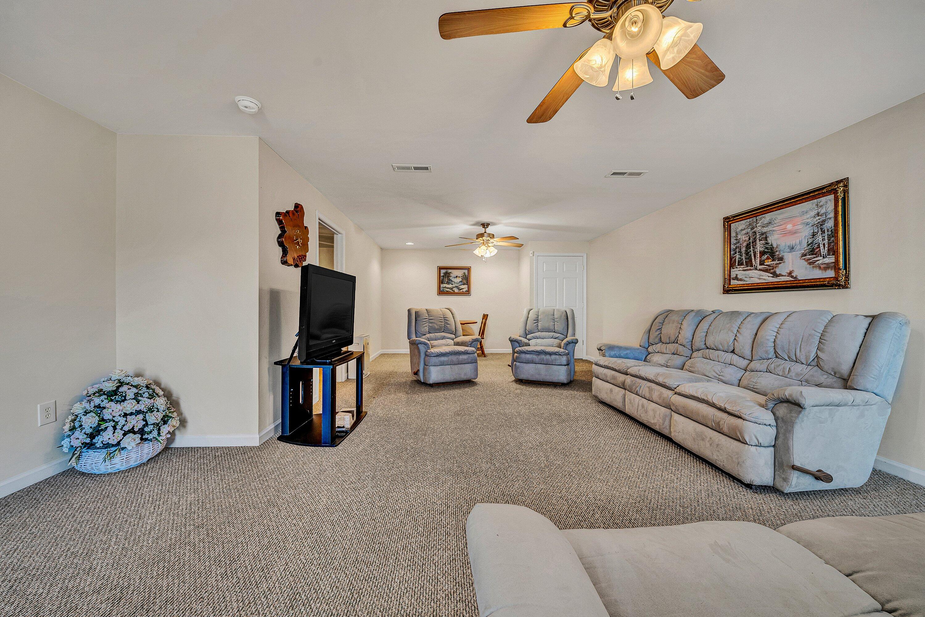 1850 Emmaus Church Road Moneta, VA 24121 - Photo 37 of 63 a living room with furniture and a flat screen tv