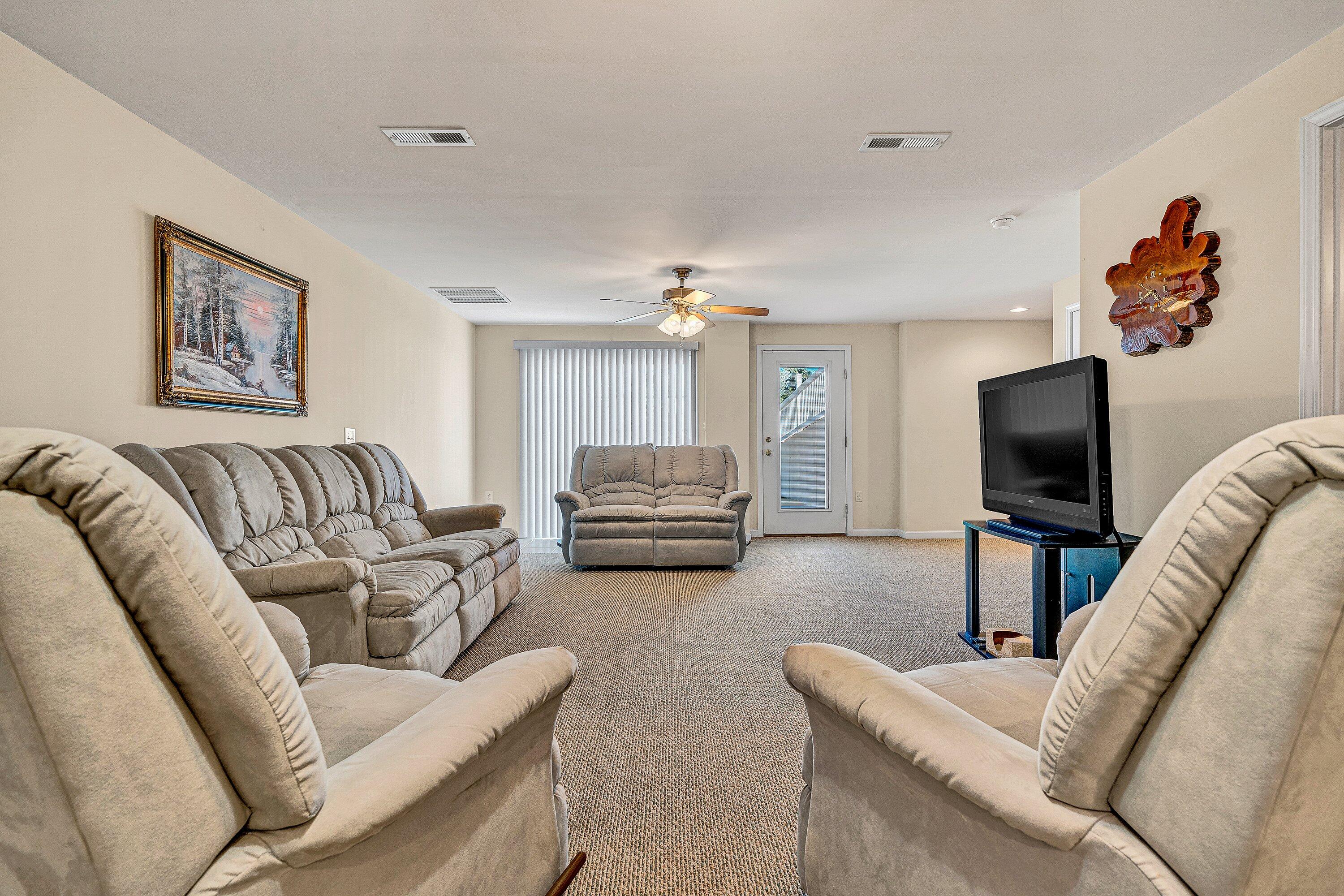 1850 Emmaus Church Road Moneta, VA 24121 - Photo 39 of 63 a living room with furniture and a flat screen tv