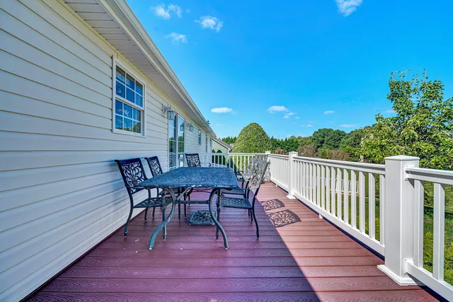 a view of a grassy field with trees