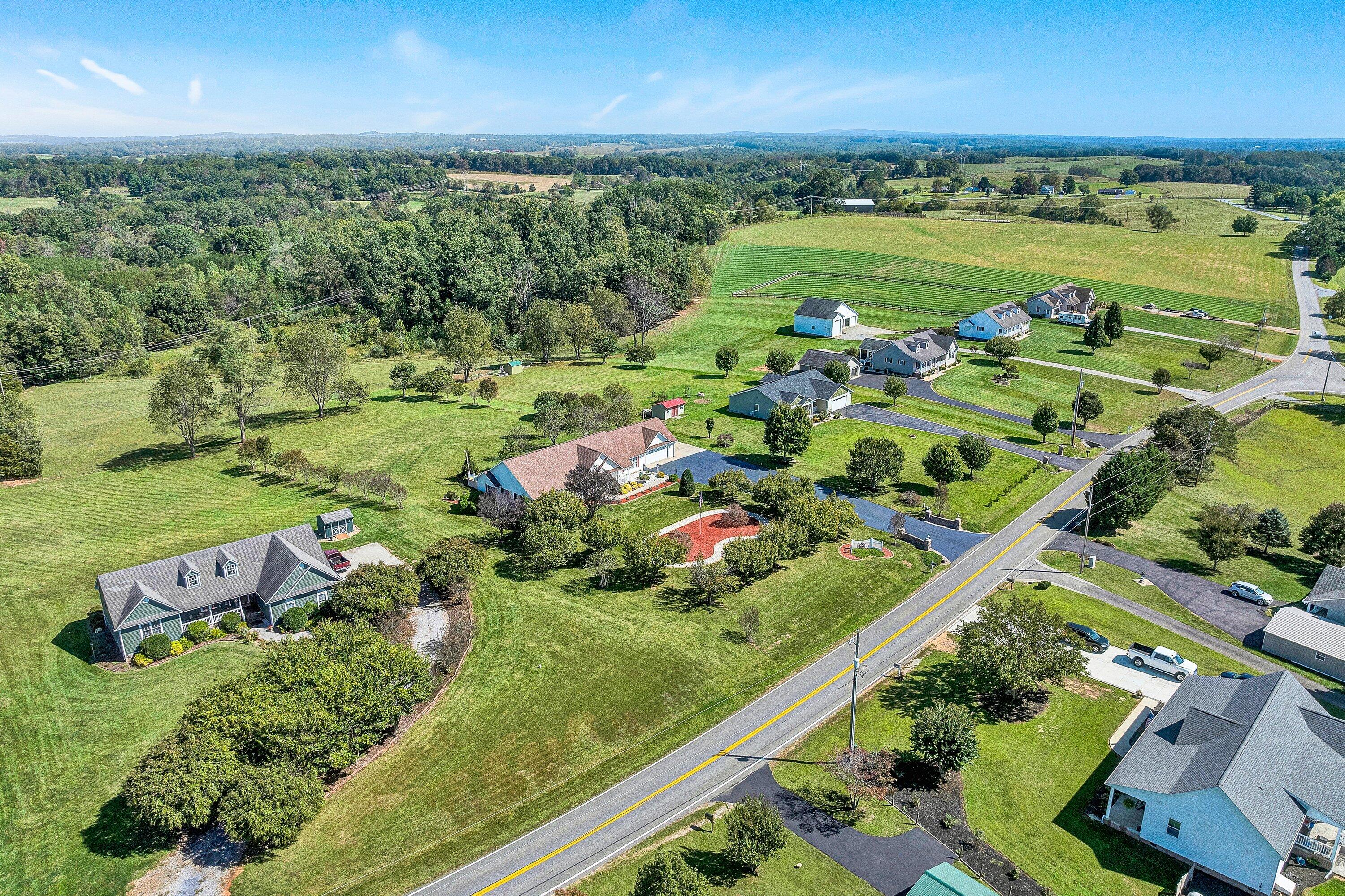 1850 Emmaus Church Road Moneta, VA 24121 - Photo 52 of 63 an aerial view of a houses with a yard and lake view