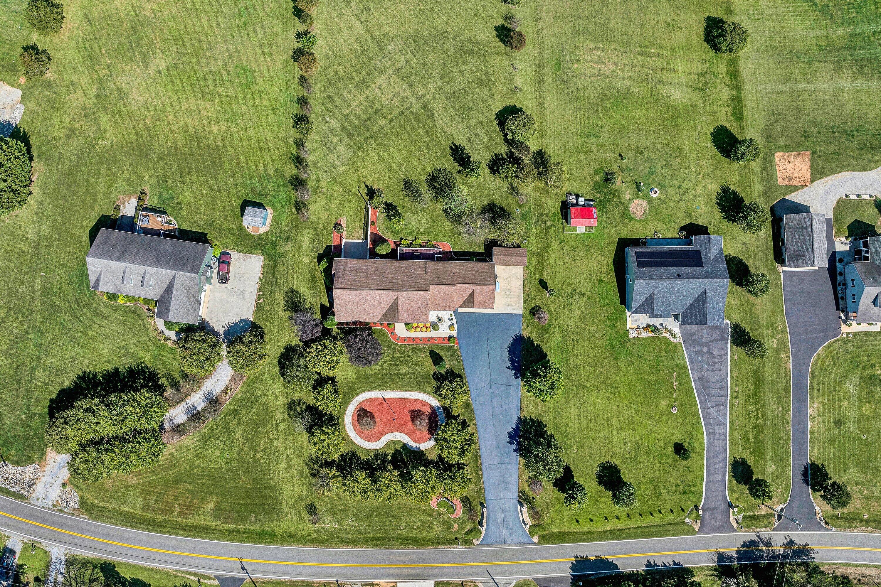 1850 Emmaus Church Road Moneta, VA 24121 - Photo 56 of 63 an aerial view of residential house with outdoor space and parking