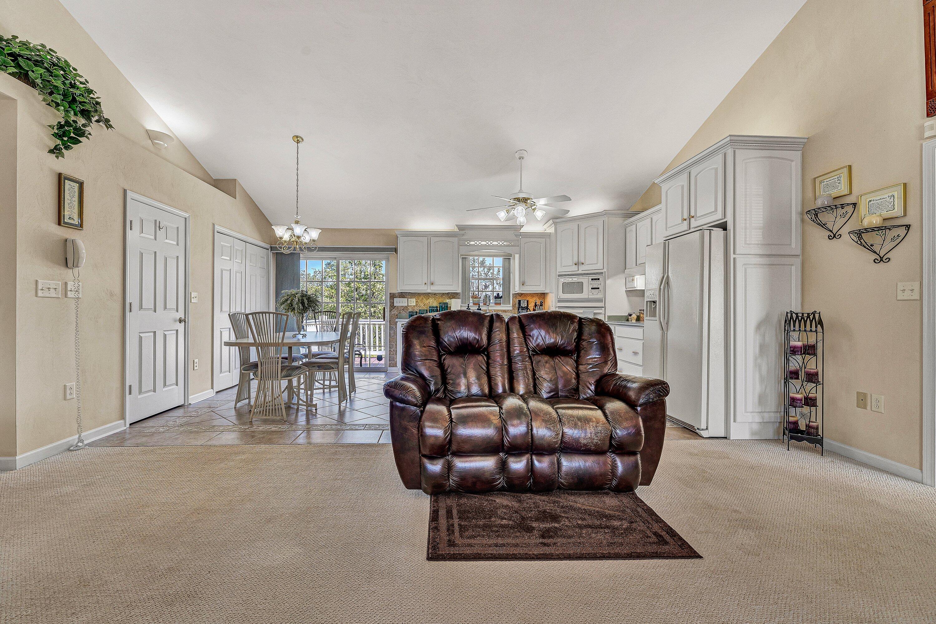 1850 Emmaus Church Road Moneta, VA 24121 - Photo 7 of 63 a living room with furniture and a chandelier