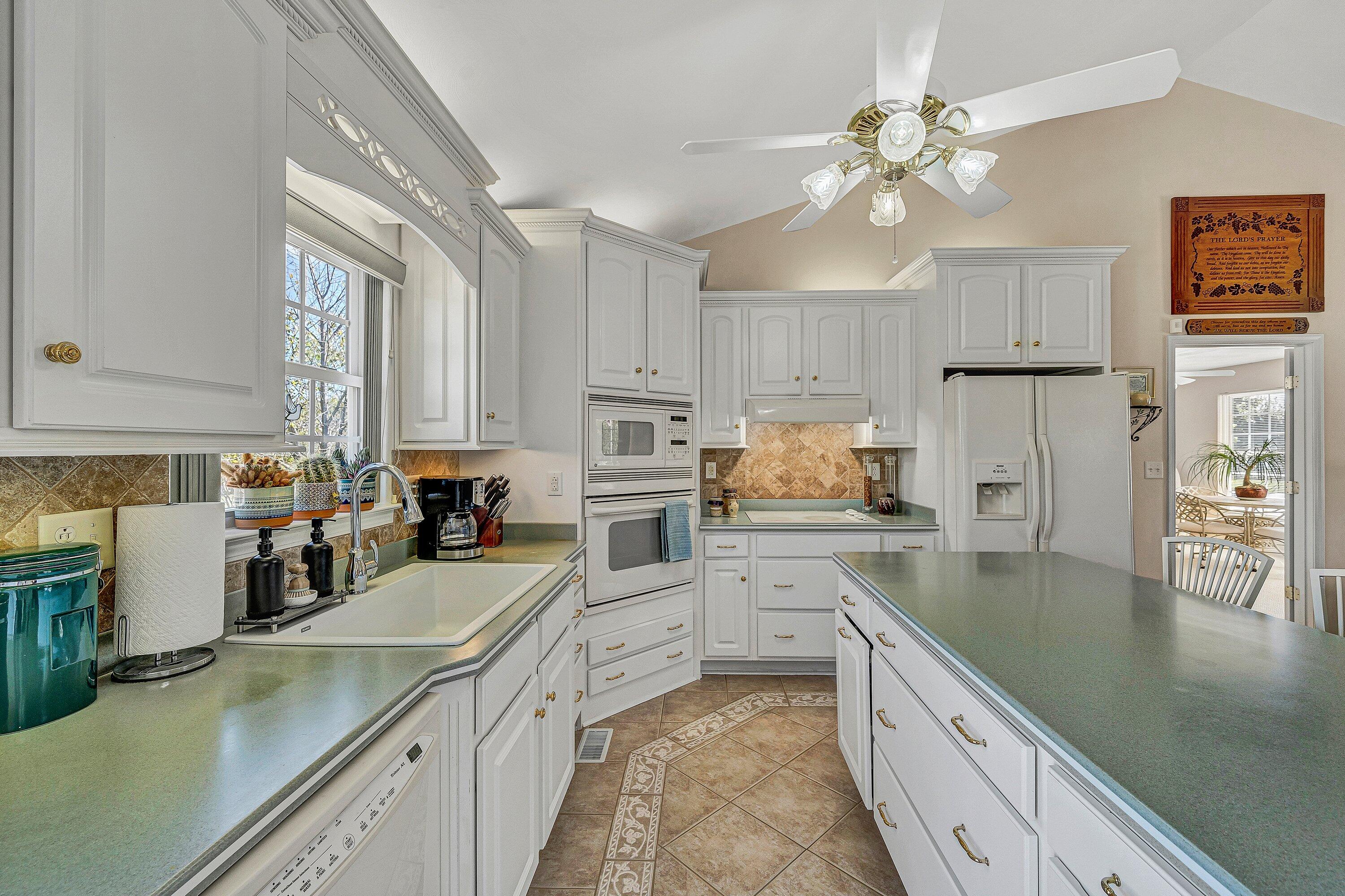 1850 Emmaus Church Road Moneta, VA 24121 - Photo 9 of 63 a kitchen with a sink a counter top space appliances and cabinets