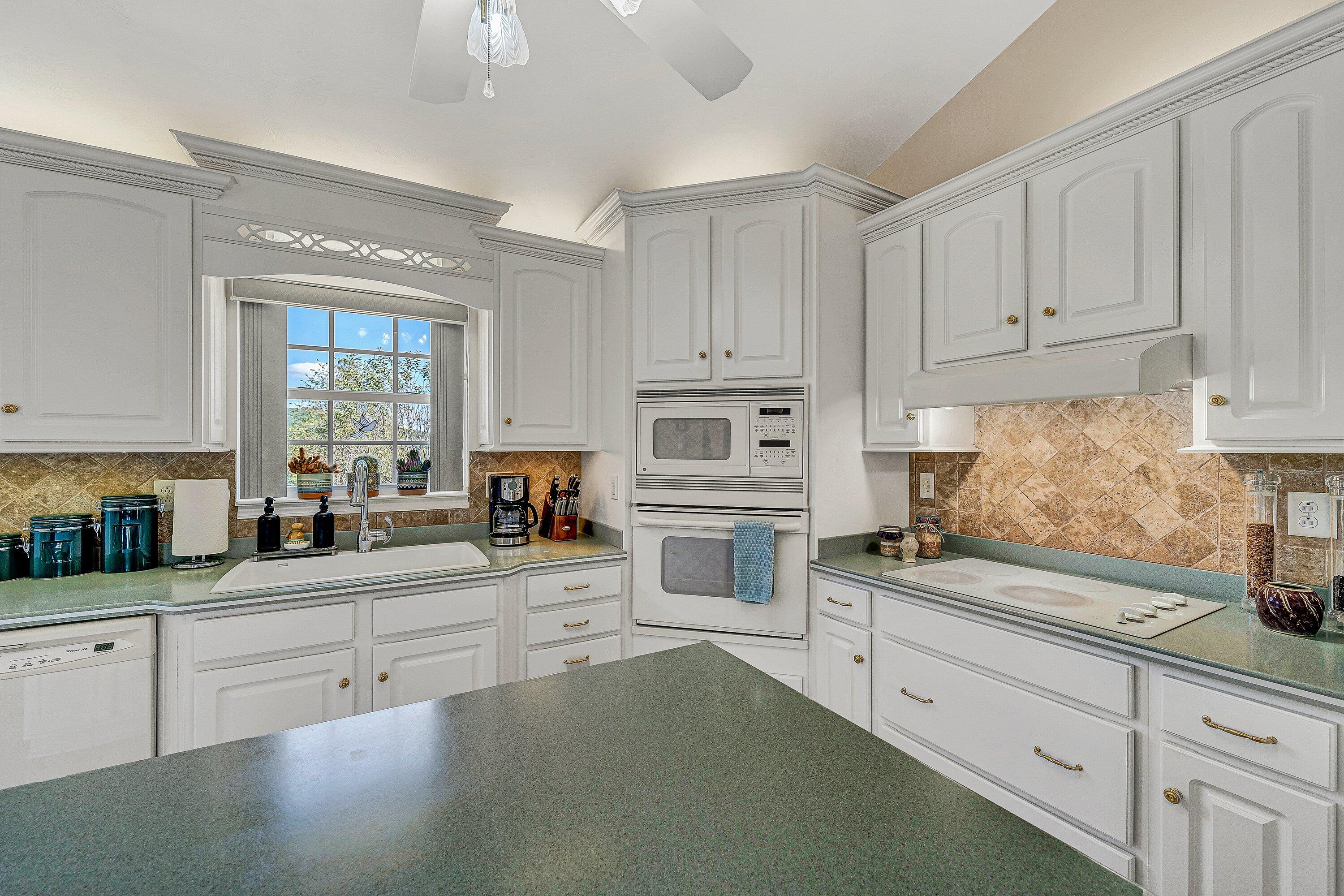 1850 Emmaus Church Road Moneta, VA 24121 - Photo 10 of 63 a kitchen with cabinets appliances a sink and a window