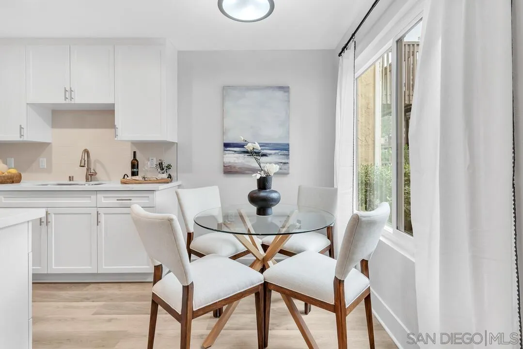 8644 Via Mallorca, Unit F La Jolla, CA 92037 - Photo 12 of 34 a dining room with furniture and window