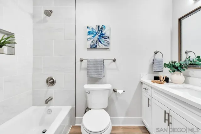 a bathroom with a sink a toilet and a bathtub