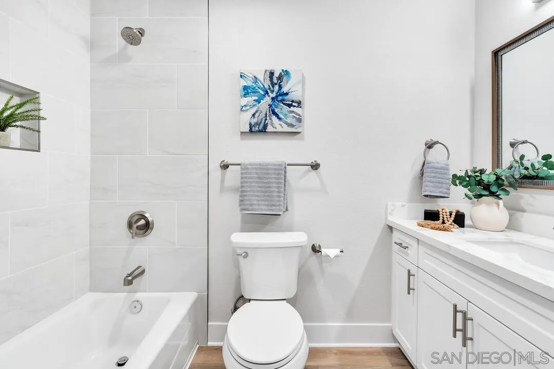 8644 Via Mallorca, Unit F La Jolla, CA 92037 - Photo 20 of 34 a bathroom with a sink a toilet and a bathtub