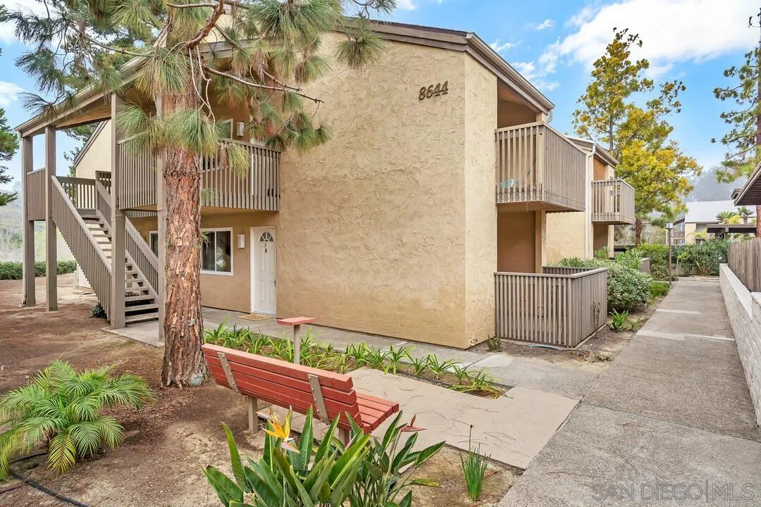 8644 Via Mallorca, Unit F La Jolla, CA 92037 - Photo 2 of 34 a backyard of a house with lots of green space