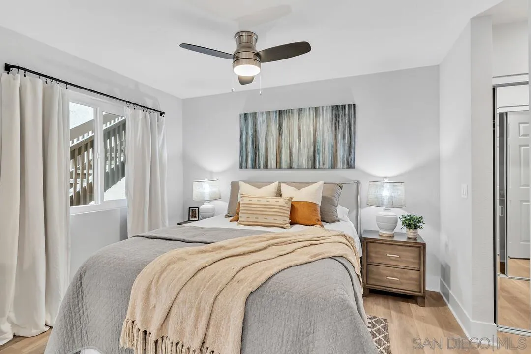 8644 Via Mallorca, Unit F La Jolla, CA 92037 - Photo 9 of 34 a bedroom with bed and a window