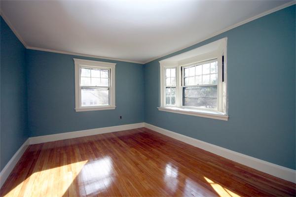 14 Woodleigh Road Dedham, MA 02026 - Photo 13 of 24 a view of an empty room with wooden floor and a window