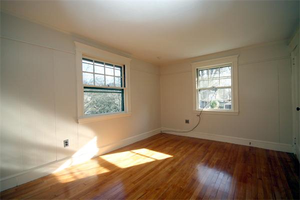 14 Woodleigh Road Dedham, MA 02026 - Photo 14 of 24 an empty room with wooden floor and windows