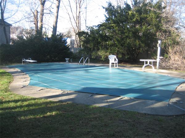 14 Woodleigh Road Dedham, MA 02026 - Photo 18 of 24 a swimming pool with outdoor seating and yard